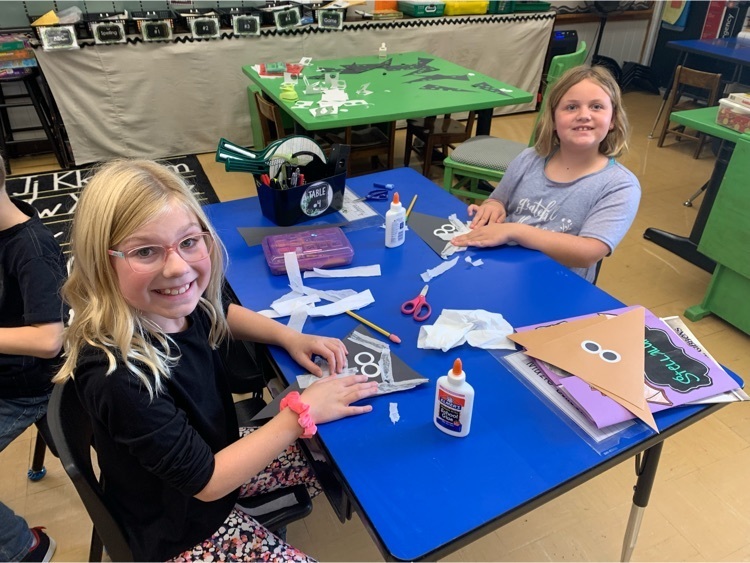 Second graders creating artwork