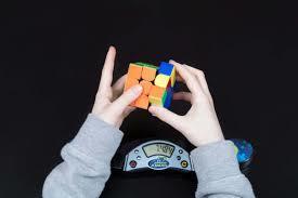 picture of person using a rubiks cube